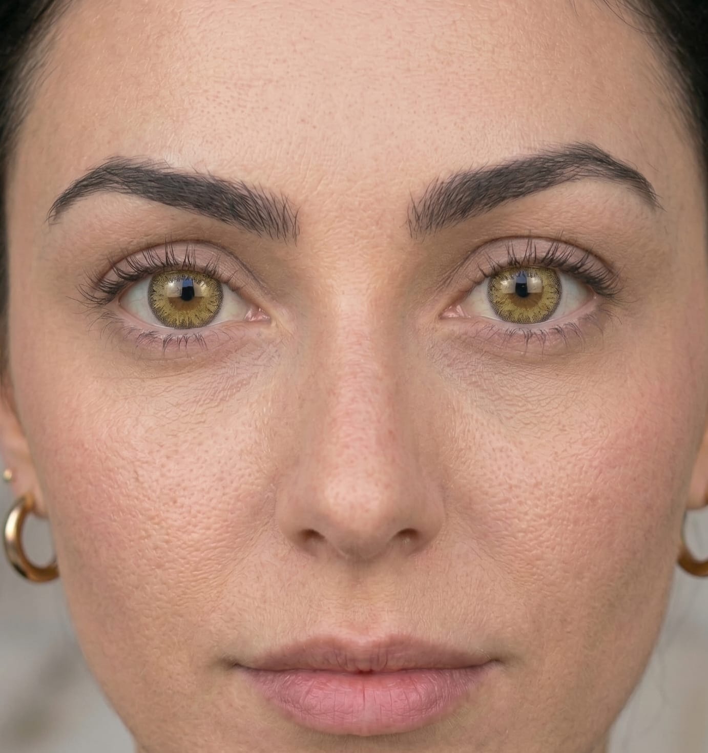 Gold Hazel contact lens model wearing lenses